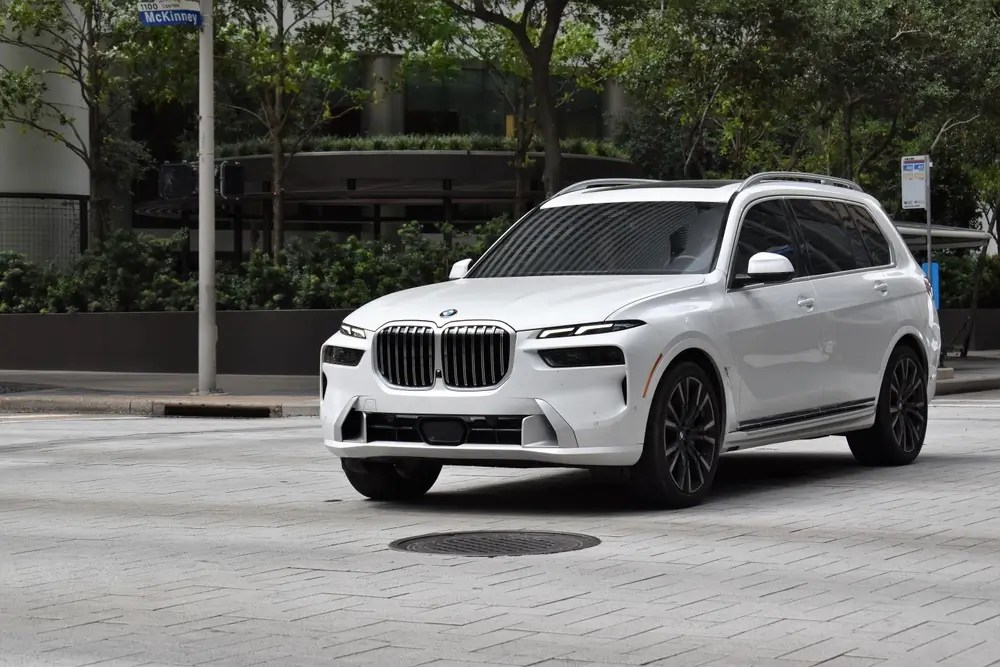 BMW X7 luxury SUV, cruising in the downtown city.